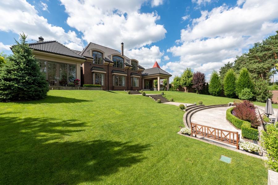 Brick manor and landscaped grounds